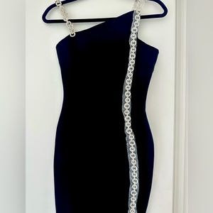 Bandage dress with rhinestone straps.